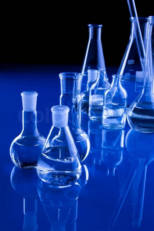 Molecules and flasks in lab, stock photo