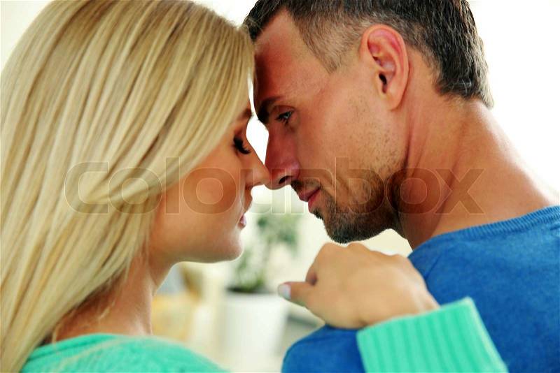 Portrait of a man and a woman face to face, stock photo