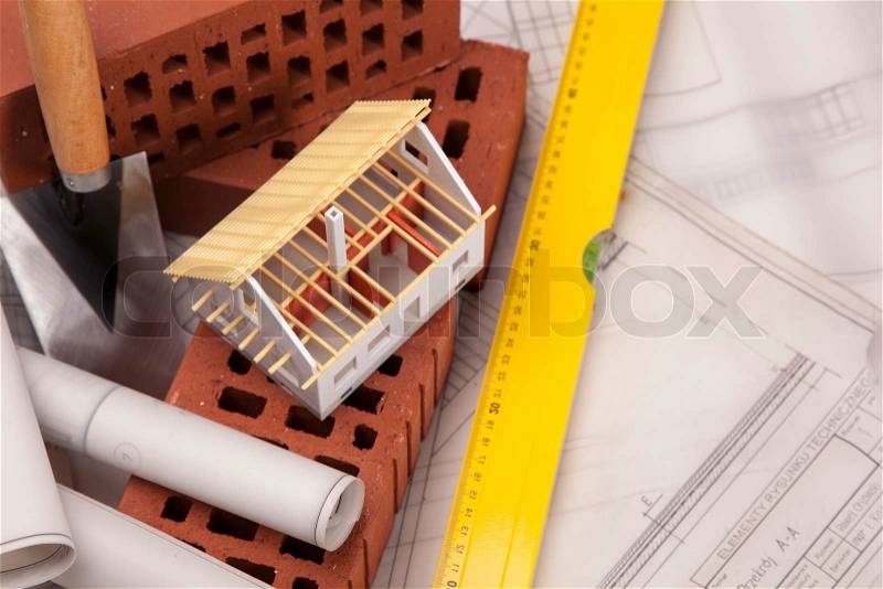 Building and construction equipment on blueprints, stock photo