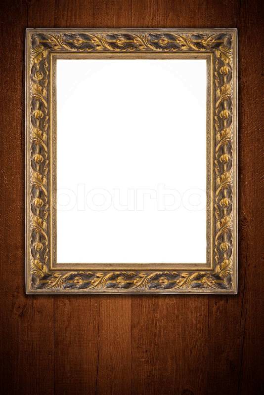 Old picture frame on vintage wood wall, stock photo