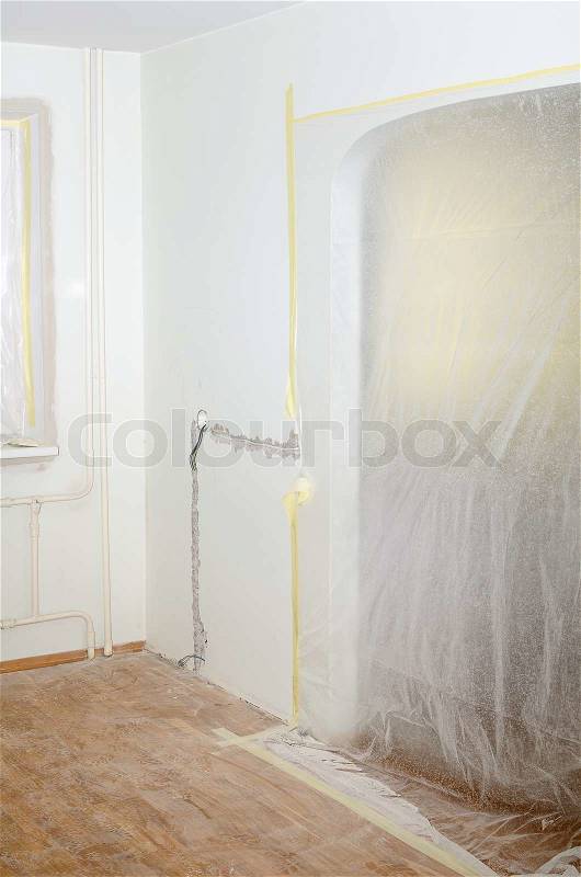Room renovation. White room repair with dirty floor, stock photo