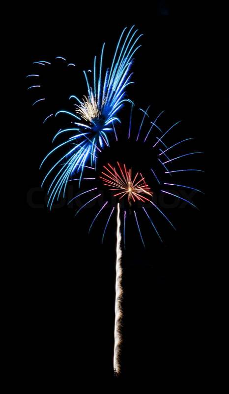 Photo of colorful, exploding red white and blue pinwheel shaped fireworks in the night sky during a July 4th holiday celebration. Very easy to place in your nigth sky image. Add the photo as a new layer and then select the Screen blend mode. , stock photo