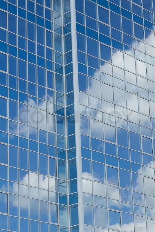 Glass building with cloud reflections, stock photo