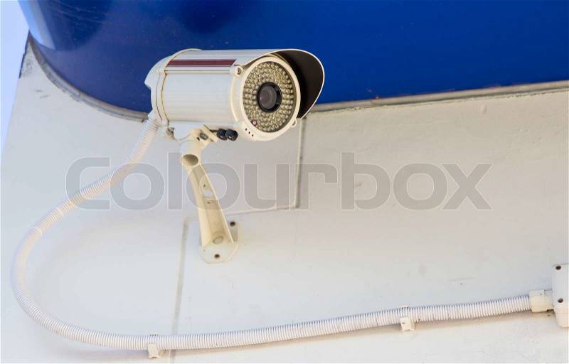 A security camera outside an office building, stock photo