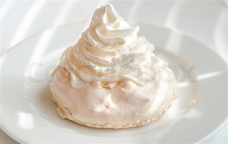 Meringue cake with whipped cream, stock photo