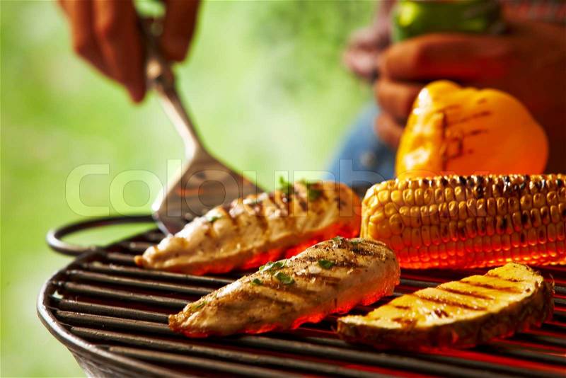 Grilling meat, bell pepper, corn and pineapple, stock photo