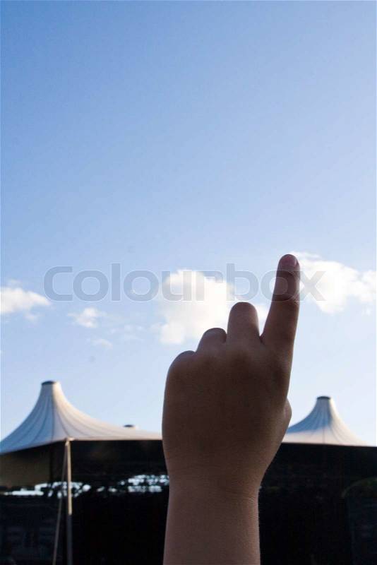 Cropped image of a hand pointing up, stock photo