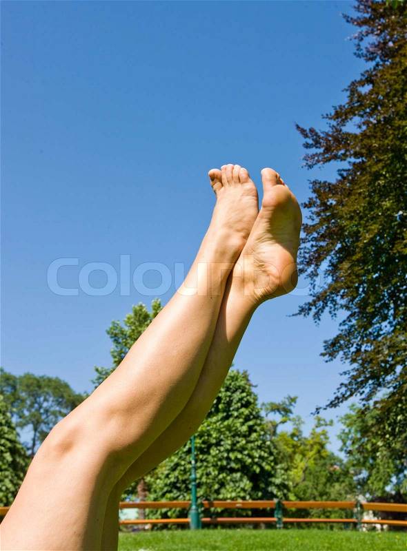 Cropped image of woman\'s legs up in the air, stock photo