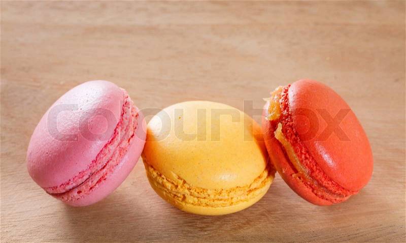 French macarons on a wooden background. , stock photo