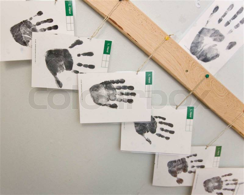 Hand prints hanging on a wall, stock photo