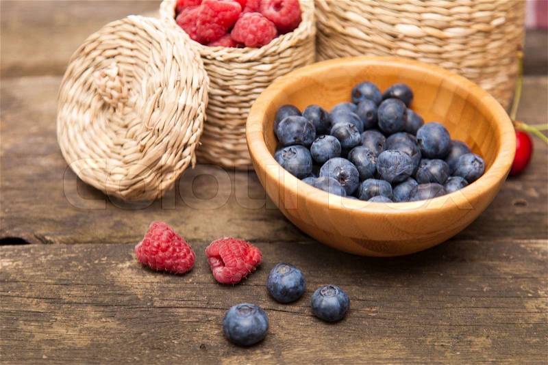 Fresh berries on a wooden table, stock photo