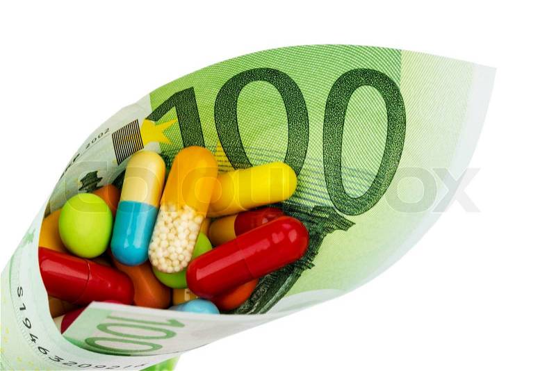 Tablets and one hundred euro banknote symbolic photo: cost of medicine and drugs in the pharmaceutical industry, stock photo