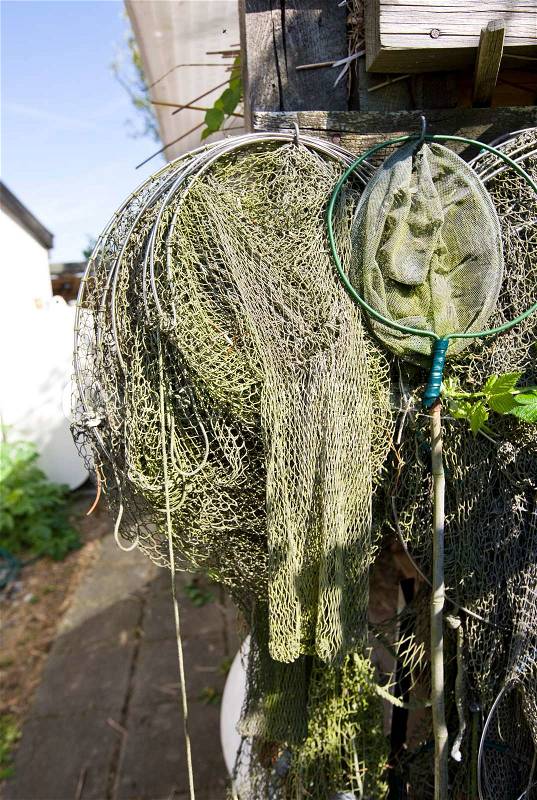 Fish net hanging on a marina, stock photo