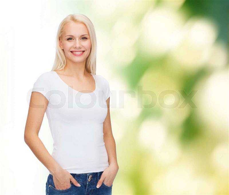 T-shirt design concept - smiling woman in blank white t-shirt, stock photo