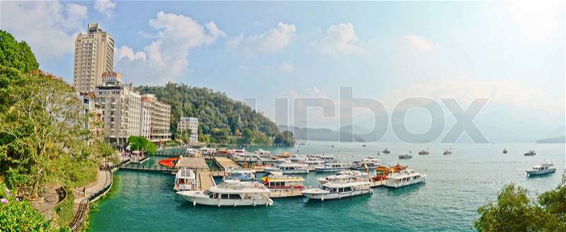SUN MOON LAKE - OCT 25: many boats parking at the pier on October 25, 2013 at Sun Moon Lake, Taiwan. Sun Moon Lake is the largest body of water in Taiwan as well as a tourist attraction, stock photo