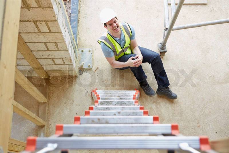 Construction Worker Falling Off Ladder And Injuring Leg, stock photo