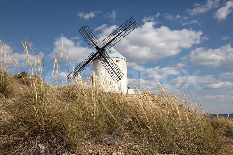 Traditional spanish windmill in Castilla-La Mancha, Spain, stock photo