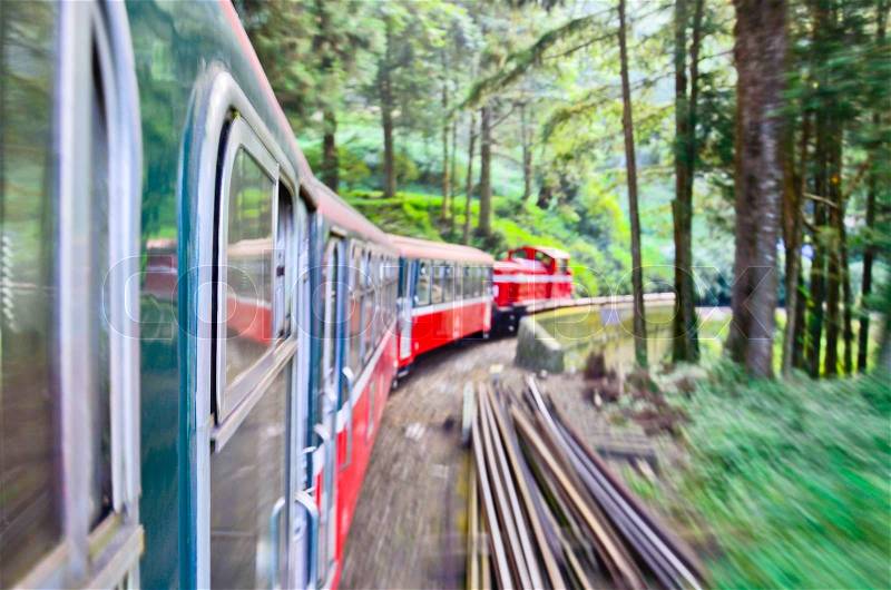 Forest railway with train move blurred in Alishan National Scenic Area, Taiwan, Asia, stock photo