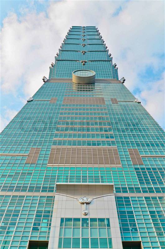 TAIPEI, TAIWAN - OCT 26 : A view to Taipei 101 from busy corner in Xinyi financial district of Taipei city October 26, 2013 in Taipei, TW. The building is the world\'s second tallest at 509 meters, stock photo