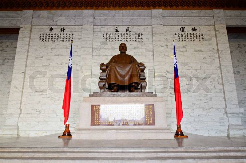 TAIPEI, TAIWAN - OCT 22: A large bronze statue of Chiang Kai-shek on October 22, 2013 in Taipei, Taiwan. This huge bronze statue dominates the main hall of the CKS memorial hall in Taipei, Taiwan, stock photo