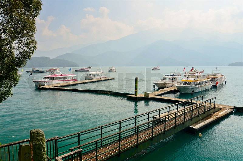 SUN MOON LAKE - OCT 25: many boats parking at the pier on October 25, 2013 at Sun Moon Lake, Taiwan. Sun Moon Lake is the largest body of water in Taiwan as well as a tourist attraction, stock photo