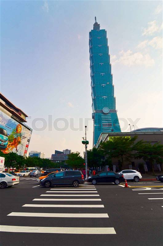 TAIPEI, TAIWAN - OCT 26 : A view to Taipei 101 from busy corner in Xinyi financial district of Taipei city October 26, 2013 in Taipei, TW. The building is the world\'s second tallest at 509 meters, stock photo