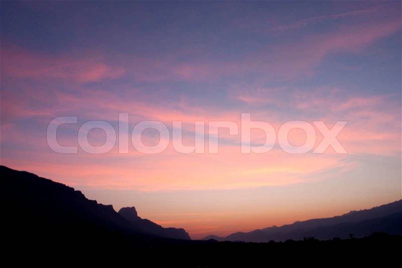 The rising sun and beautiful clouds with bright pink and blue cirrus clouds in light. , stock photo
