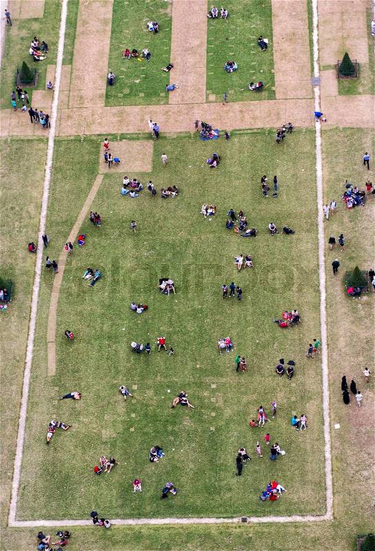 Crowd of people relaxing in the gardens at summer season. Aerial view from a vantage point, stock photo