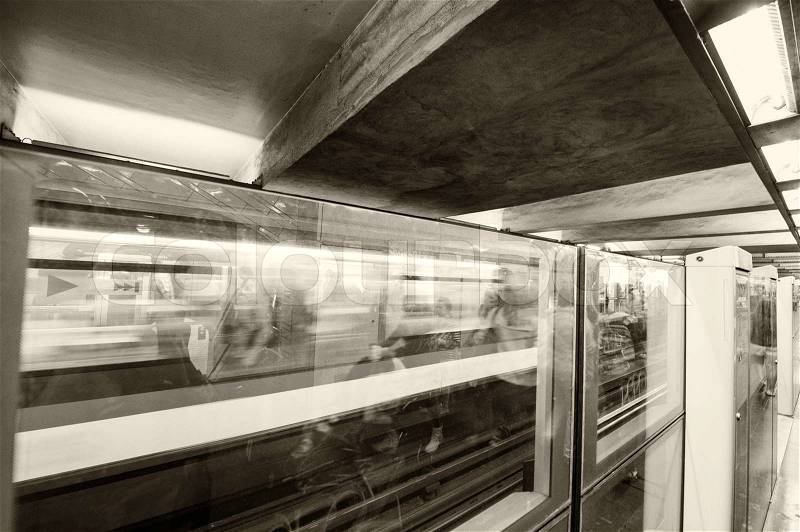 PARIS - JUNE 22, 2014: Underground train in metro station. More than 4 million people use city subway system every day, stock photo