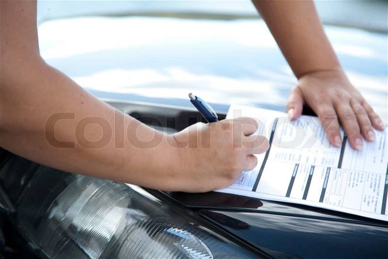 A man signing a car lease, stock photo