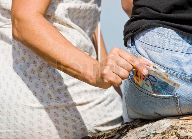 Cropped image of a woman stealing money, stock photo