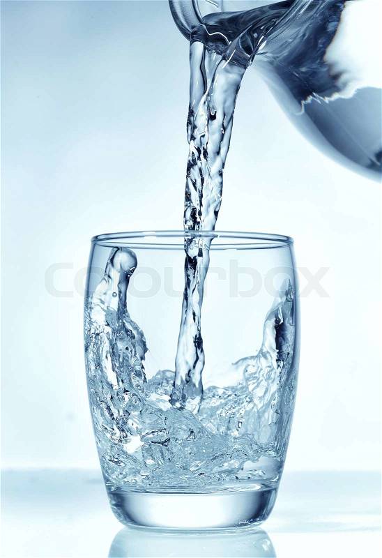 Fresh water pouring into glass , stock photo
