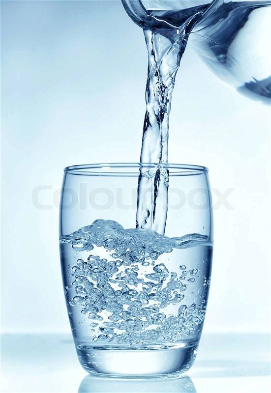 Fresh water pouring into glass , stock photo