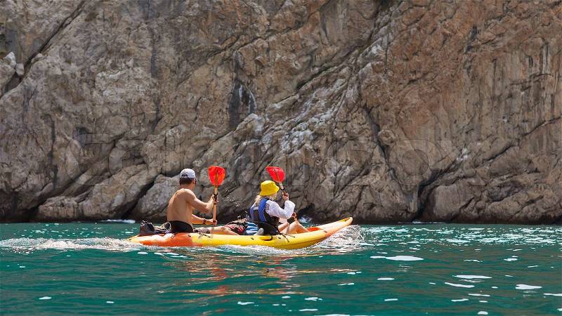 Kayak. People kayaking in the ocean, stock photo