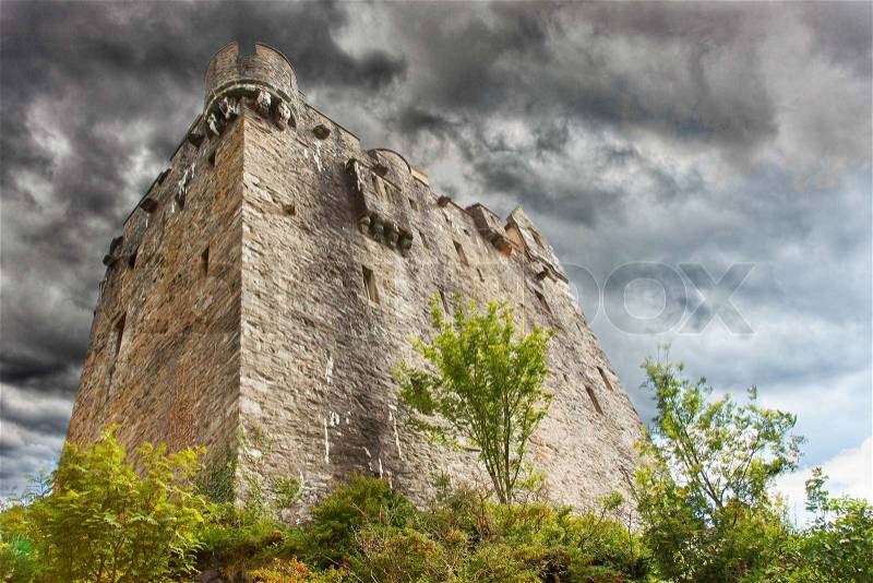 Stormy sky over ruins of a small castle, stock photo