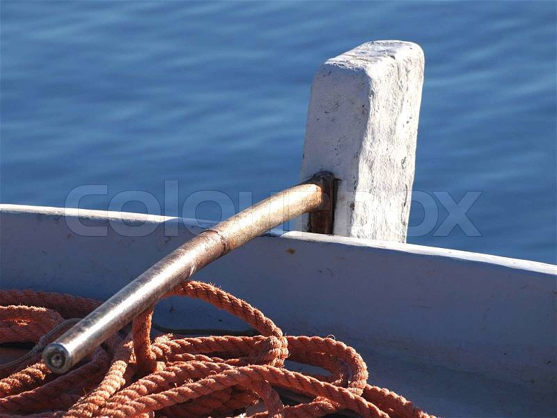 Rudder and ropes on old wooden boat , stock photo