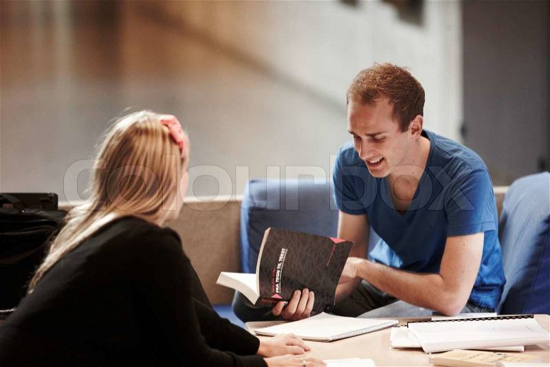 College students exchanging ideas, stock photo