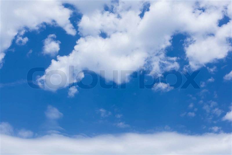 Sky. Dramatic fluffy white and grey clouds and blue sky, stock photo