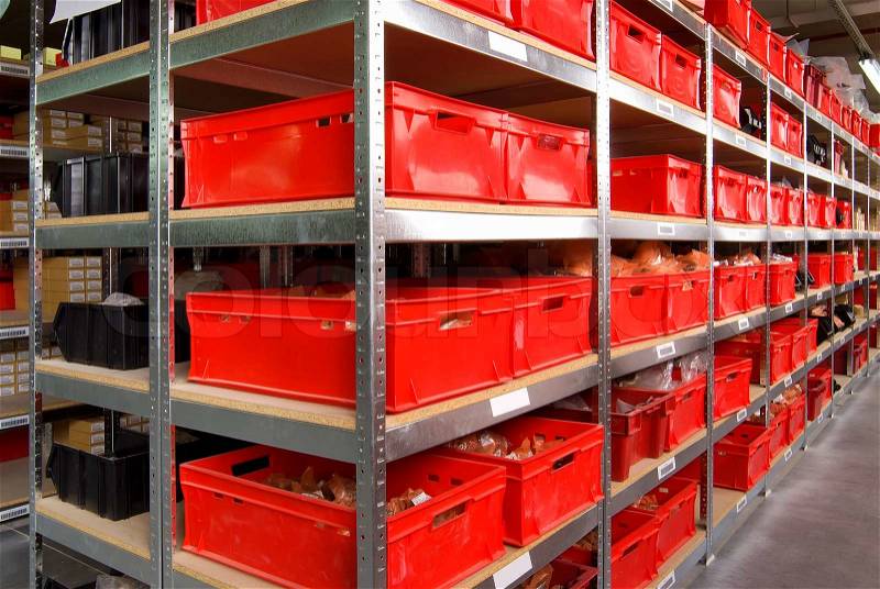 Storage room with red plastic drawers and shelves, stock photo