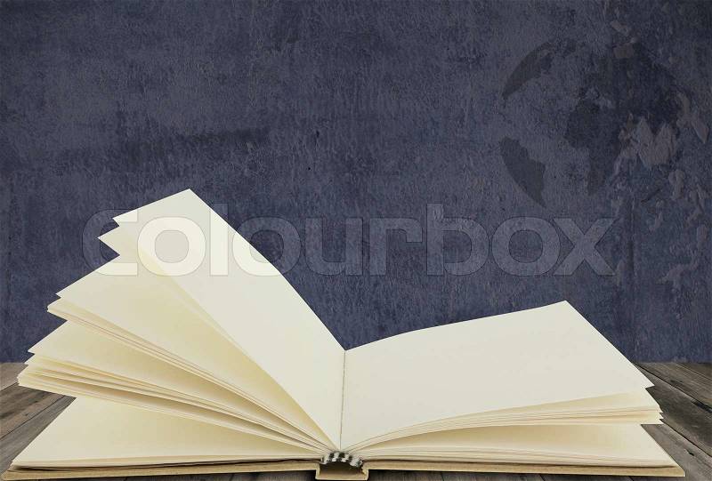Recycle notebook on wood floor with grunge background, stock photo