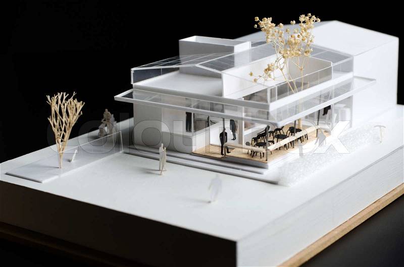 Architectural model of a modern building on black background, stock photo