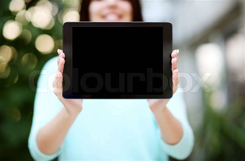 Closeup portrait of a female hands holding tablet computer with blank screen, stock photo