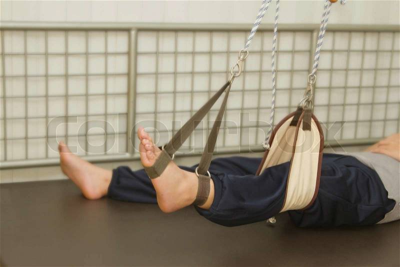Leg exercise with suspension set for rehab muscle strength, stock photo