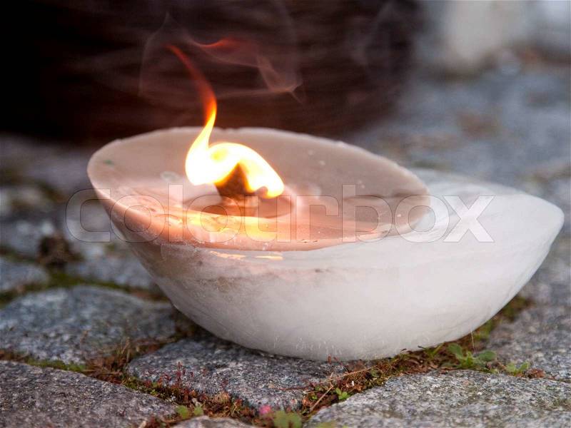 Lighted outdoor candles, stock photo
