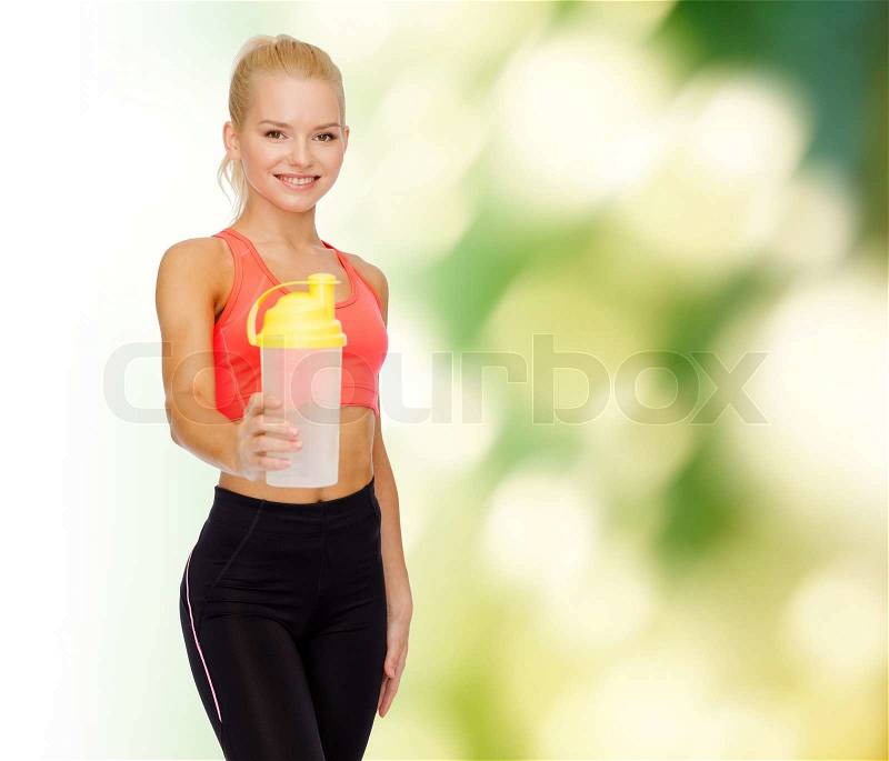 Sport, fitness and diet concept - smiling sporty woman with protein shake bottle, stock photo