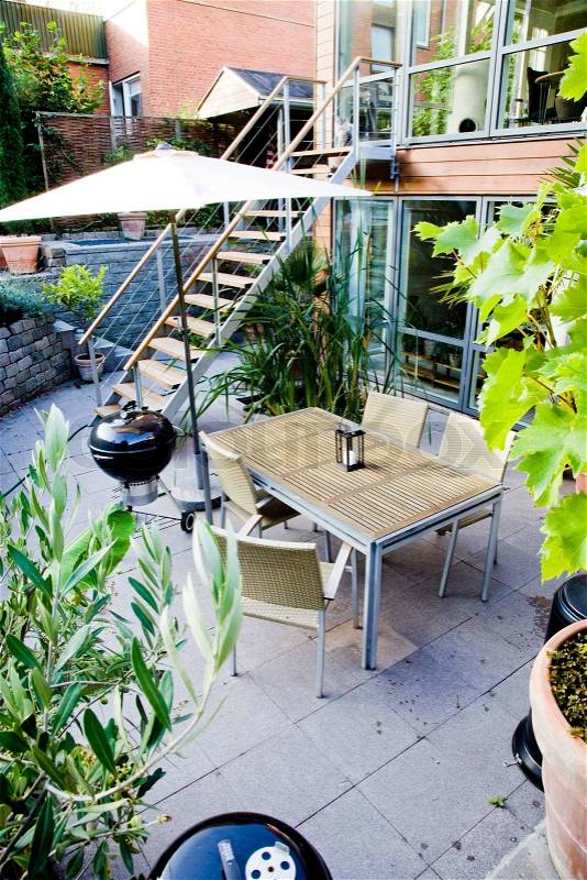 Patio with garden furniture, stock photo