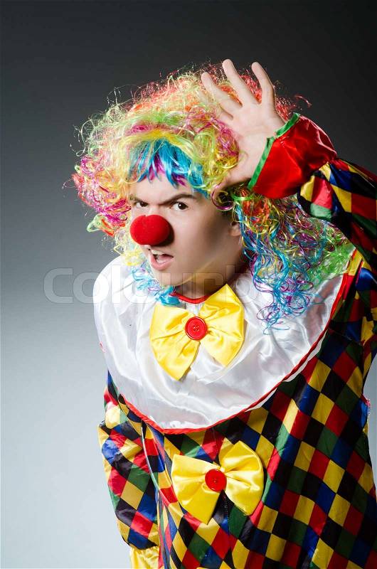 Funny clown in the studio, stock photo