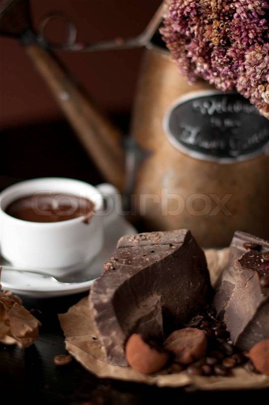 Piece of chocolate bar with hot chocolate drink, stock photo
