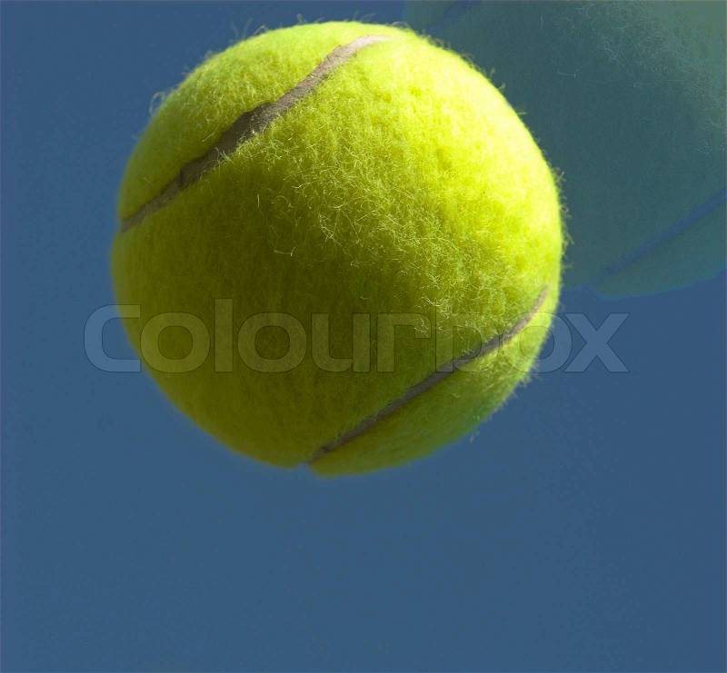 Yellow tennis ball sky blue, stock photo