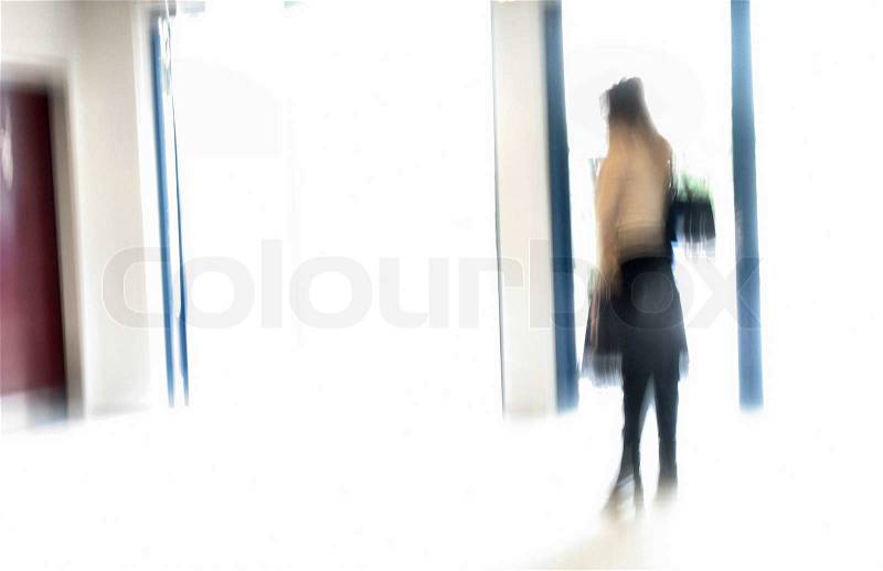 Stressed business woman waiting for an appointment. Motion blur in capture, stock photo